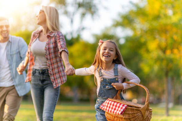 istock Happy young family of three smiling while spending time together 1257060184