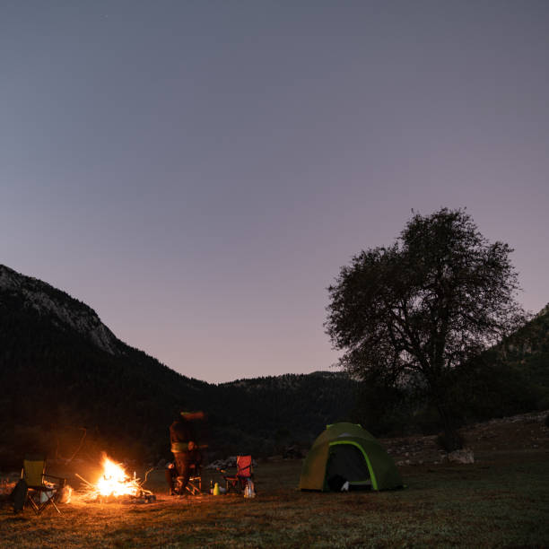 istock Friends Camping Under The Stars In Nature 1257060247
