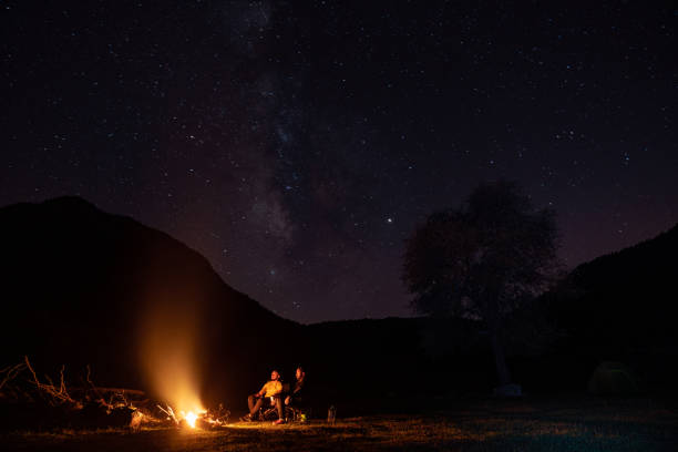 istock Friends Camping Under The Stars In Nature 1257061581