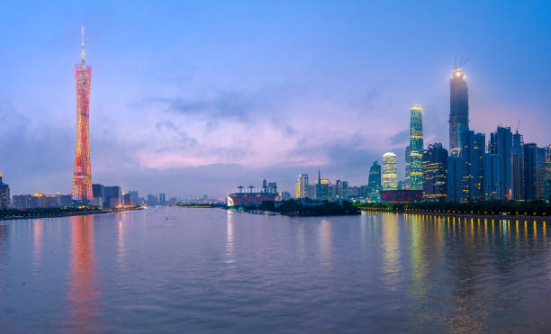 istock Guangzhou, China skyline on the river at dusk. 1257062722