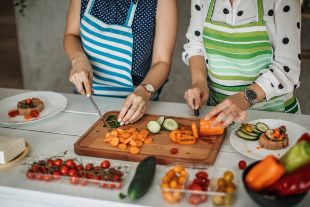 istock Young women preparing food in the kitchen 1257064007