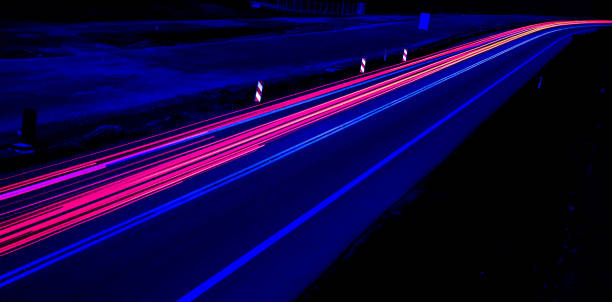 istock car lights at night on the road 1257065950