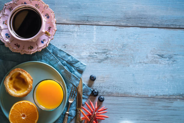 istock Breakfast Cofee with Portuguese egg tart with orange juice pastel de nata 1257066062