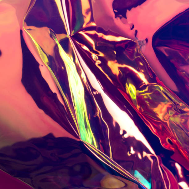 istock Futuristic holographic material. Defocused wrinkled foil texture. 1257069800