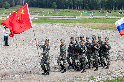 military competition ARMY 2018, a platoon of soldiers of the Chinese army with the flag of the people's Republic of China marching in a parade step Кostroma Region the town of Pesochnoye June 2018