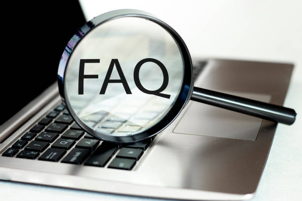 istock Laptop computer with magnifying glass, concept of search. FAQ 1257071199