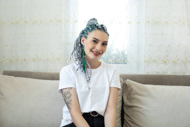 istock Young woman relaxing on the sofa at home 1257072953