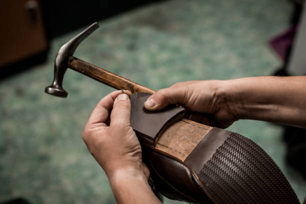 Cobler nailing shoe heel