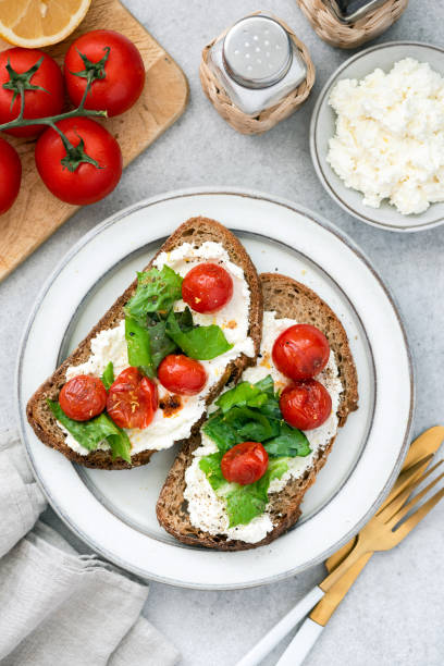 istock Bruschetta with ricotta cheese and roasted tomato 1257074452