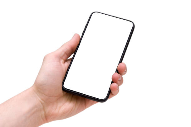 Man holding smartphone with blank screen on white background, closeup of hand. Space for text stock photo