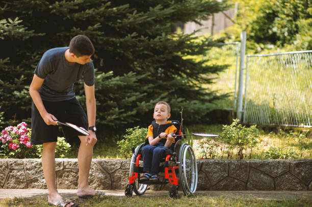 istock Disabled boy playing badminton with his brother 1257084148