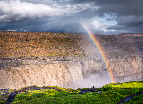 Dettifoss waterfall and rainbow, Iceland. Famous place in Iceland. A mountain valley and clouds after rain. Natural landscape in summer. Icelandic classic view. Travel - image.