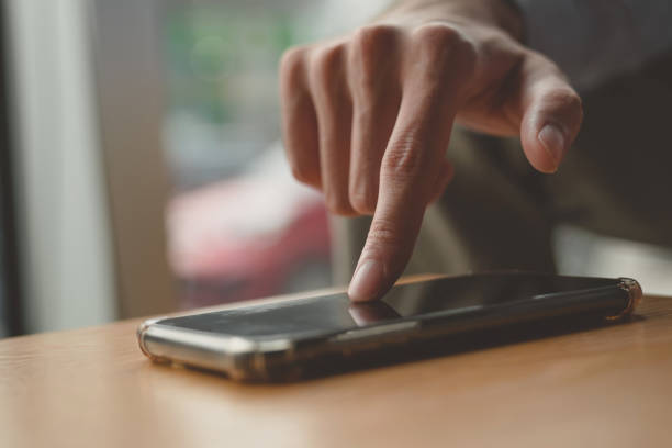 istock phone in hands doing purchases during online shopping 1257085464
