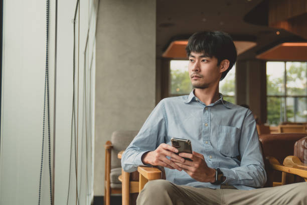 istock man received texting new mail messages on smart phone. 1257085466