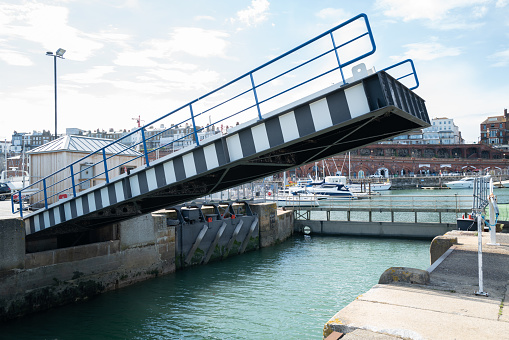 Ramsgate - July 13 2020 The bridge within the historic Royal Harbour going up at the point that the sluice gate between the inner and the outer basin is raised.