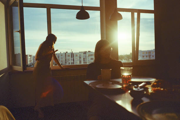 istock Friends spending time together at home. Woman using smartphone 1257086741