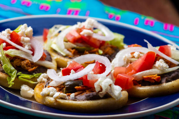 istock Mexican sopes with chicken tinga and black beans 1257087624