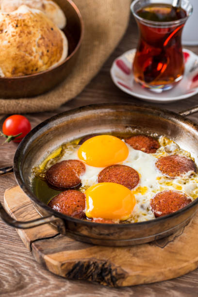 Traditional Turkish Breakfast - Fried Egg with Turkish sausage. Bread, tomato and Tea Traditional Turkish Breakfast - Fried Egg with Turkish sausage. Bread, tomato and Tea turkish sausage stock pictures, royalty-free photos & images