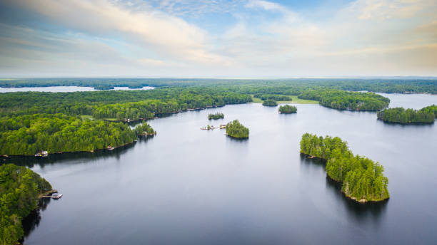 Aerial view of a lake in Canada. Aerial view of a lake in Canada. Multiple islands and a cloudy sky are visible in the image. The picture was captured with a drone. northern ontario stock pictures, royalty-free photos & images