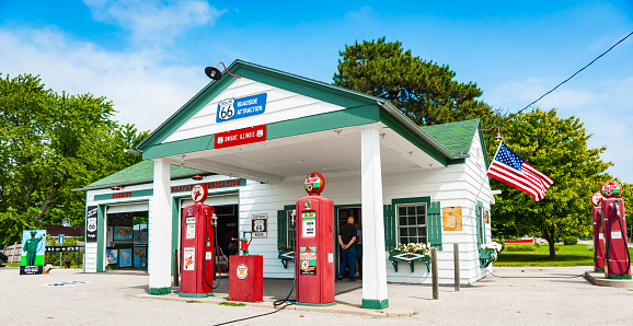 Dwight USA - August 31 2015;  Texaco garage restored with old red SkyChief fuel pumps and Route 66 Highway signs.