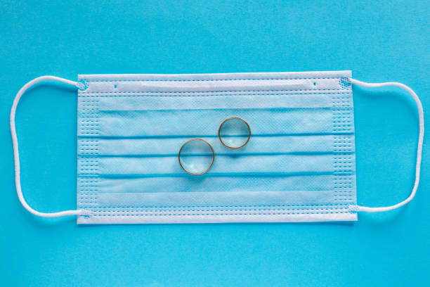 istock Wedding rings with face mask Corona facemasks 1257092872