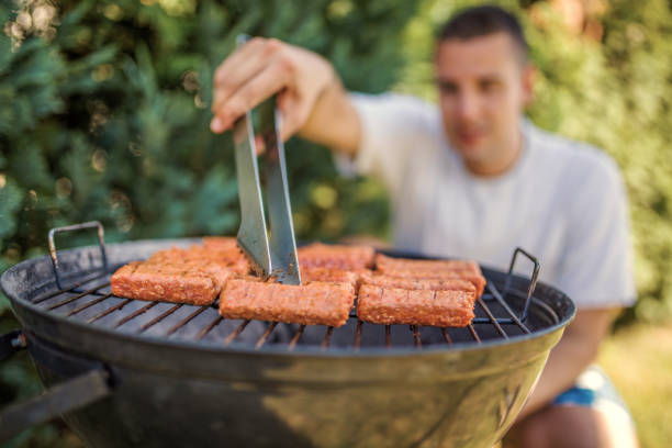 Grilling Meat on barbecue grill with coal