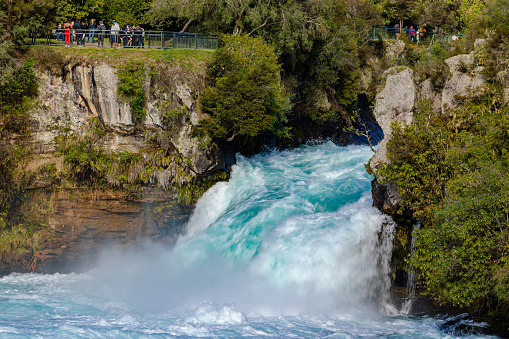 Lake Taupo enters the Waikato River through the narrow Huka falls rapids. It is a popular tourist attraction.