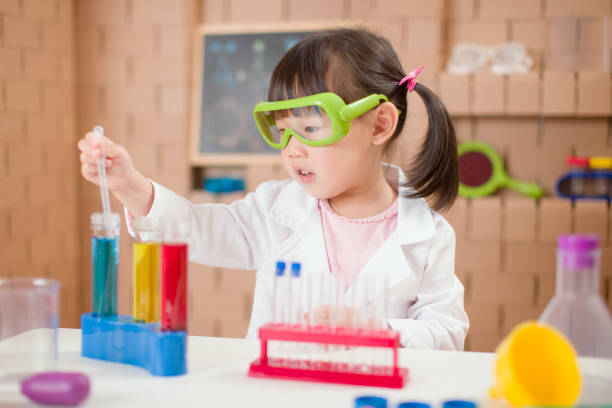 istock toddler girl play science experiments for home schooling 1257095400