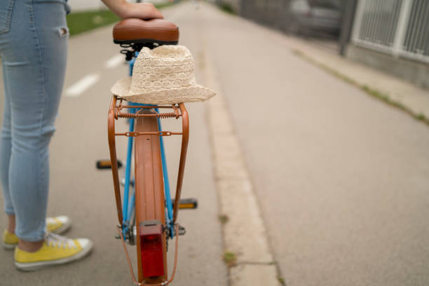 istock Young beautiful woman on a vintage bicycle. 1257096294