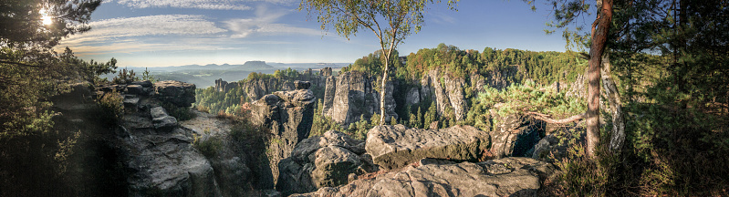 Sunrise at the Bastei bridge above the Elbe River in the Elbe Sandstone Mountains of Germany. One of the most spectacular hiking regions in Europe. The bizarre, primeval landscape of the Saxon Switzerland simply overwhelms visitors.