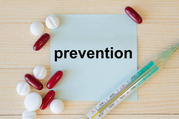 istock text prevention written on a blue background near tablets and a thermometer. medicines 1257099883