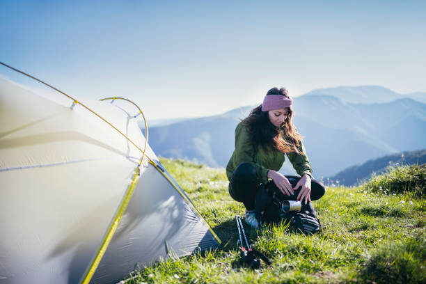 istock Adventure Woman On Camping In The Mountains. 1257108976