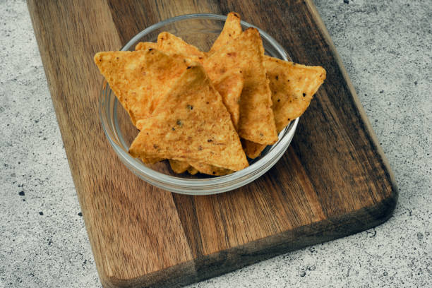istock Corn cheese, snacks with sauce on a wooden stand. Beer snack, dish on the menu. Close up. 1257109113