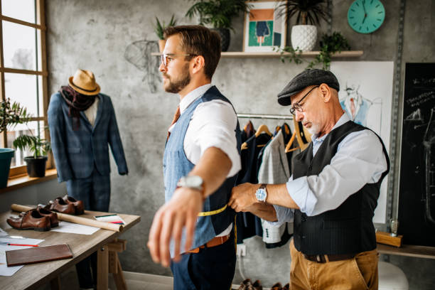 istock Senior Fashion Designer Working on His Client in a Design Studio 1257109674