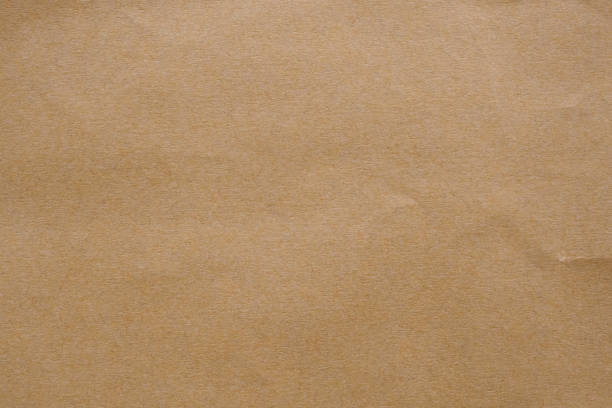 istock Brown paper recycled kraft sheet texture cardboard background 1257110119