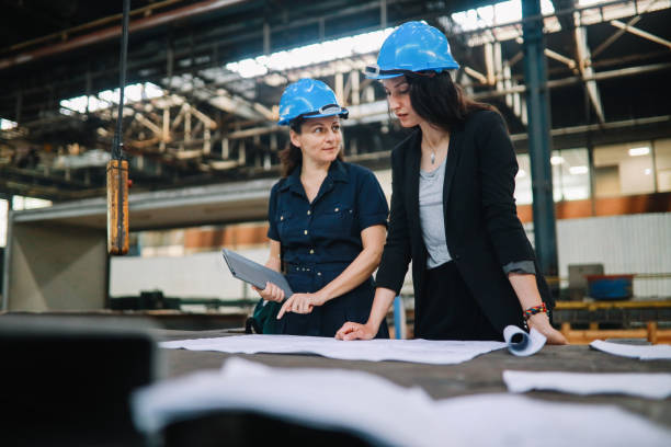 istock Female engineers working on production plans 1257111955