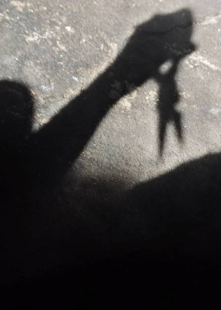 istock man's shadow using scissors. photo illustration of a psychopathic killer 1257118625