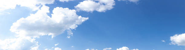 istock Wide panorama of brilliant blue sky with white clouds, creative copy space, atmosphere and weather 1257119545