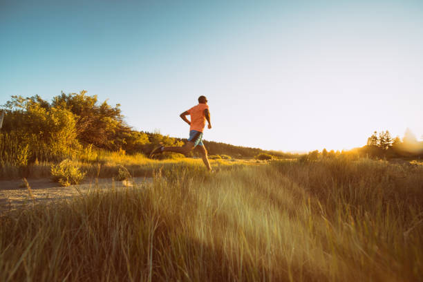 istock Active family runs, plays, and rides bikes at sunset 1257127215