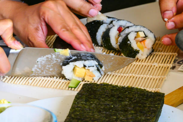 istock Making sushi rolls at home in the kitchen 1257135742