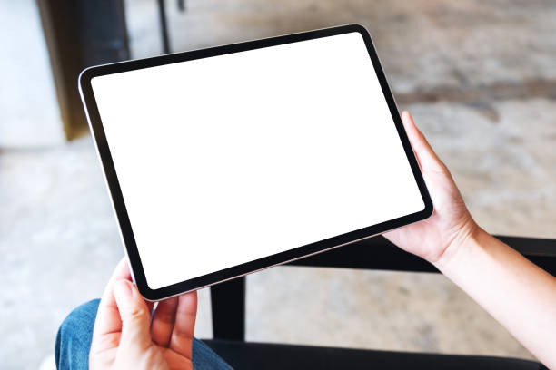 istock a woman holding black tablet pc with blank white desktop screen 1257137083