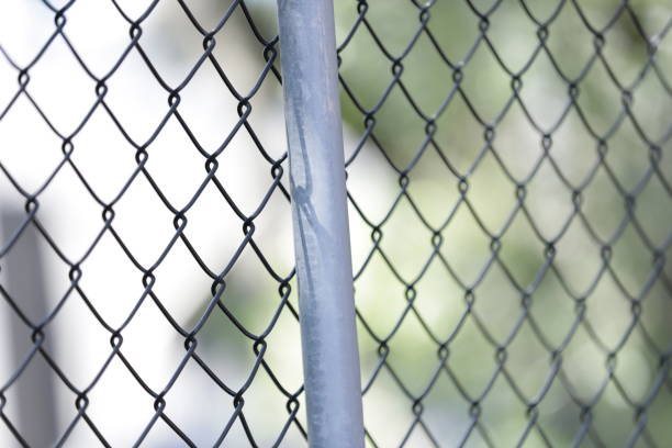 istock Chain Link fence in selective focus 1257142381
