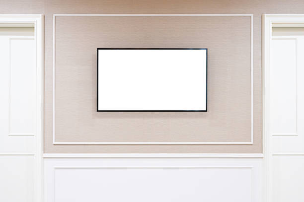 istock Smart TV Mockup with blank screen hanging on wall background. Clipping path included 1257144779