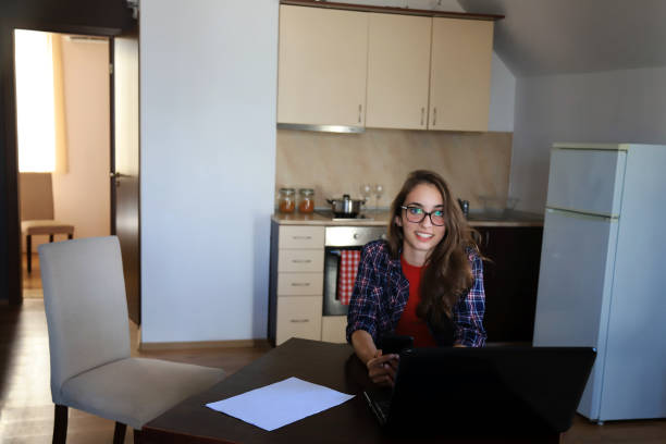 istock Young woman working in her home office 1257144791