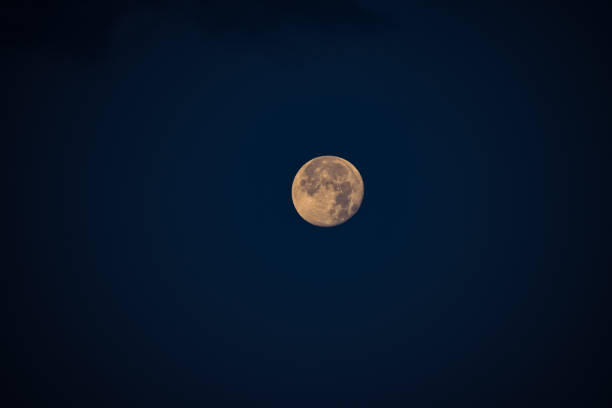 istock Full moon in a clear sky during the late hours 1257147336