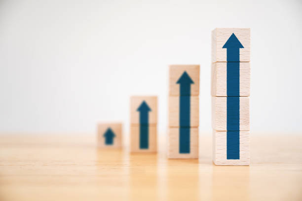 istock Ladder career path for business growth success process concept.Wood block stacking as step stair with arrow up 1257149042