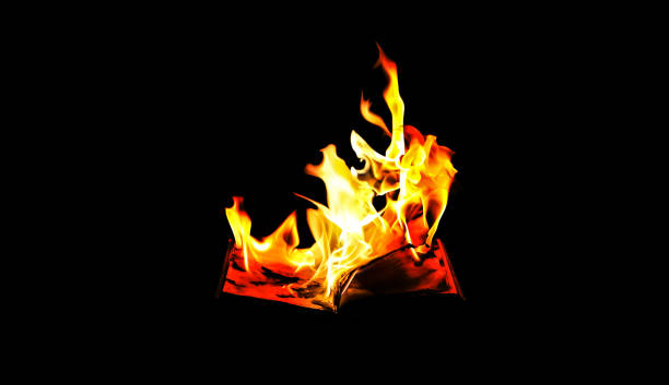 Burning book on fire at night. People don't like reading. Intellectual problems. Burning book on fire at night. People don't like reading. Intellectual problems. book burning photos stock pictures, royalty-free photos & images