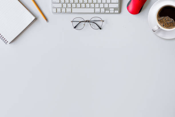 istock top view of office desk workspace with coffee cup and laptop on white table background. flat lay 1257150157