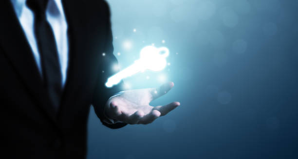 istock Businessman hand showing key to success. Problem solving to overcome work obstacles 1257158297