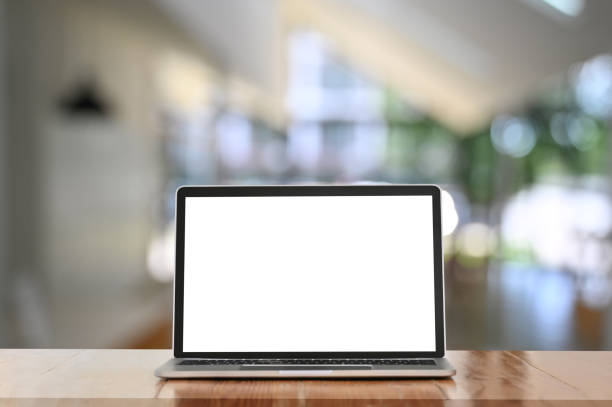 istock Screen computer laptop is putting on a wooden working desk over the blurred background. 1257159123